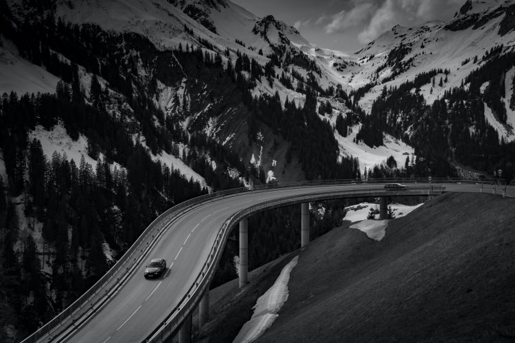 black-and-white-cars-road-mountains-66698-750×500
